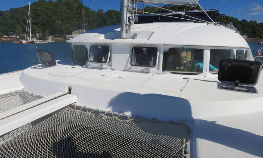 Catamaran Lagoon 380 with crew in le cratère marina, Nosy Be, Madagascar - Image 18